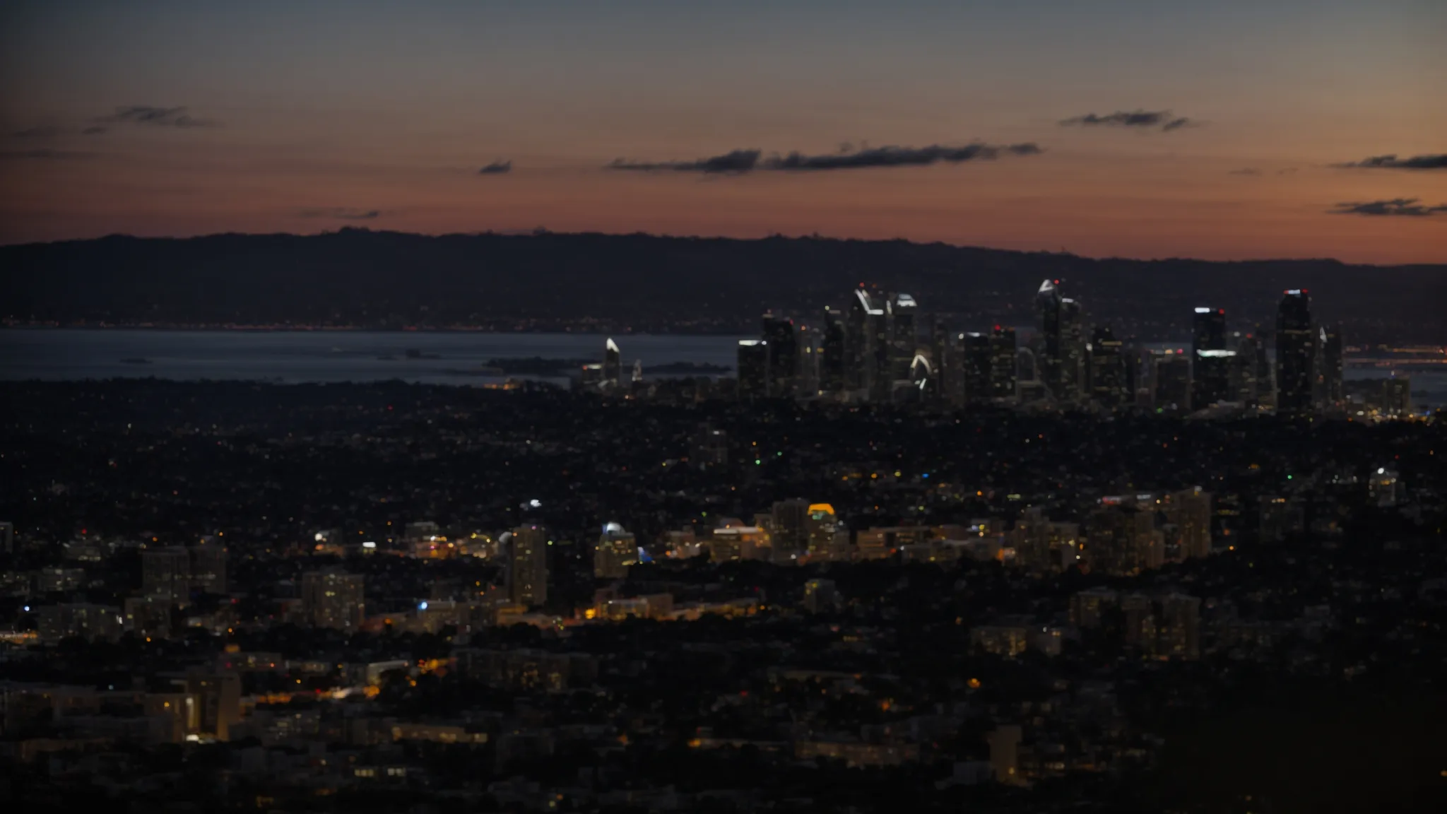 a panoramic view of san diego's skyline at dusk, capturing the city's vibrant business atmosphere.