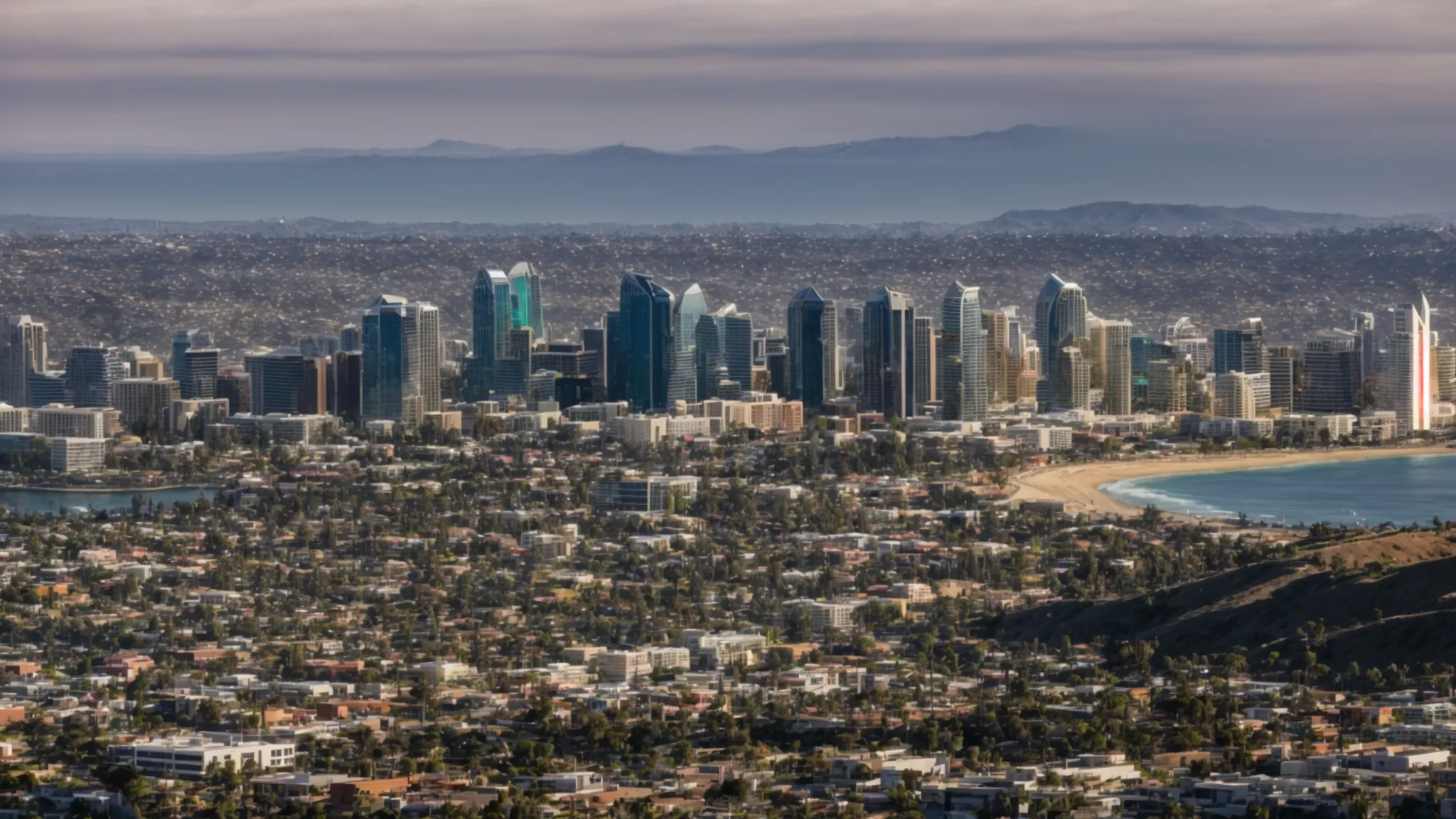 a panoramic view of san diego showing a diverse array of business districts under a clear sky.