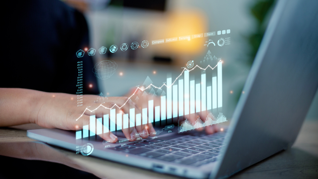 Person analyzing data on laptop with charts.